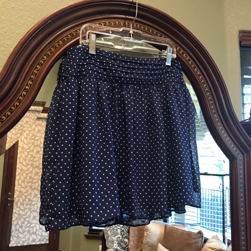 Navy blue and white polka dot mini skater skirt